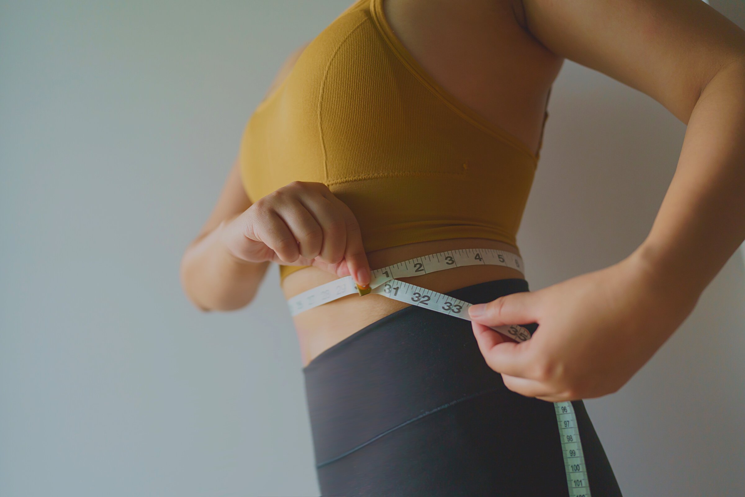 woman want to lose weight with a centimeter Shape up healthy sto